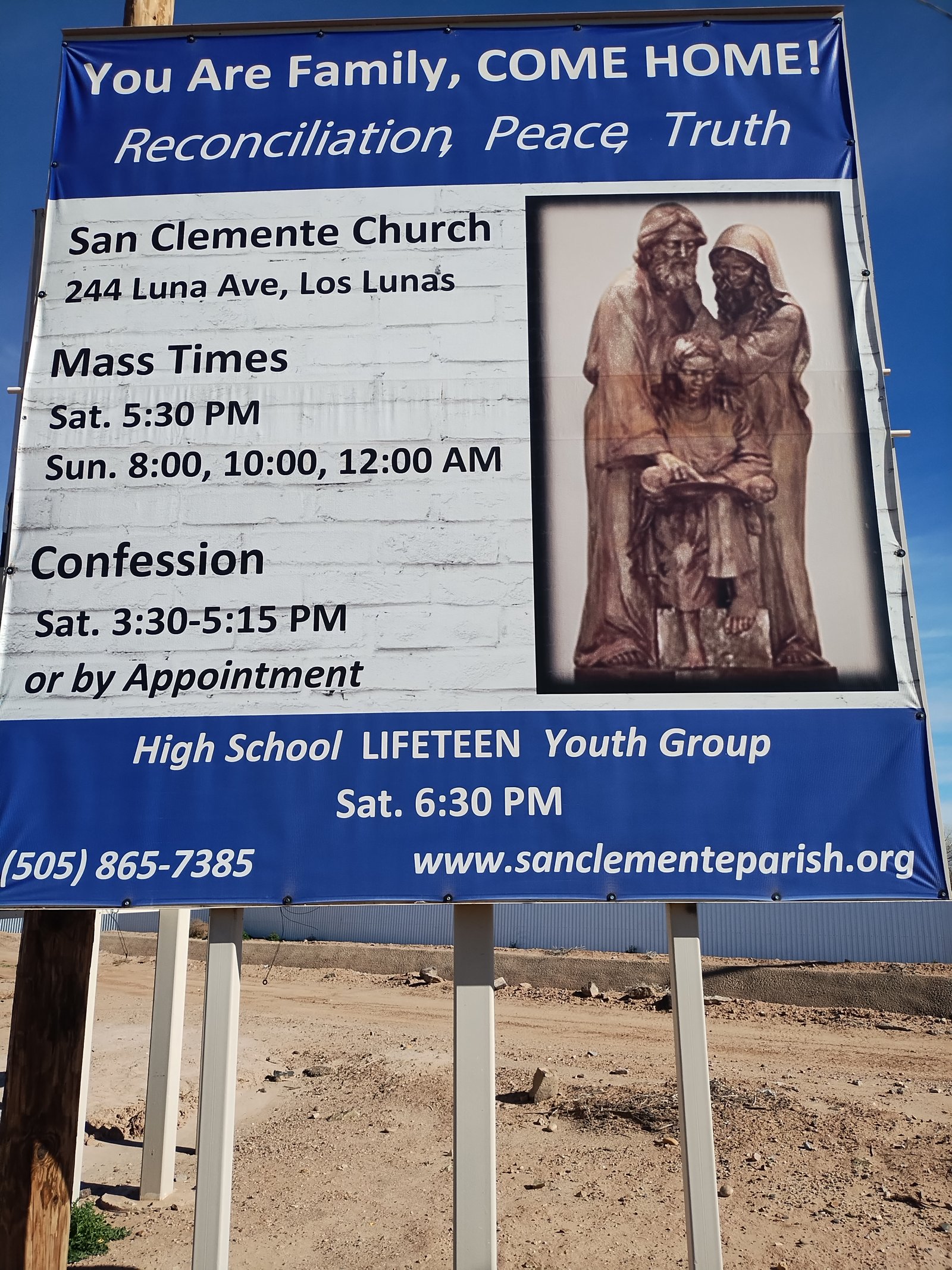 Full south-facing side of the billboard showing top and bottom panels including church-donated sign